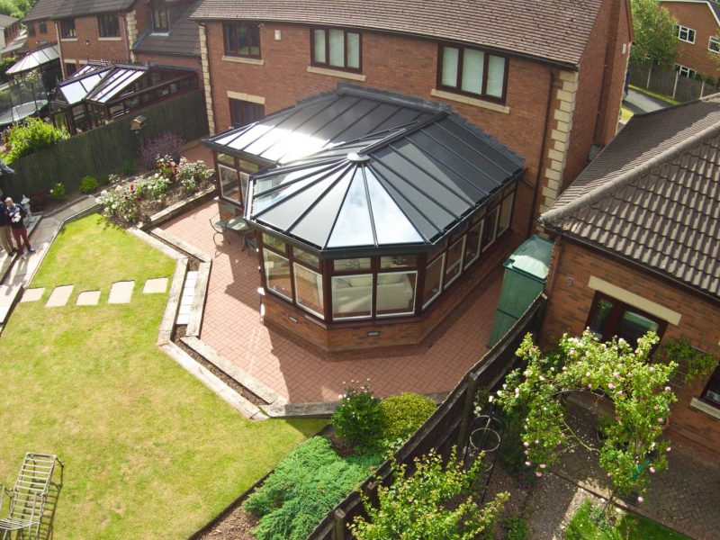 P-shaped conservatory with Solid Roofs Northamptonshire