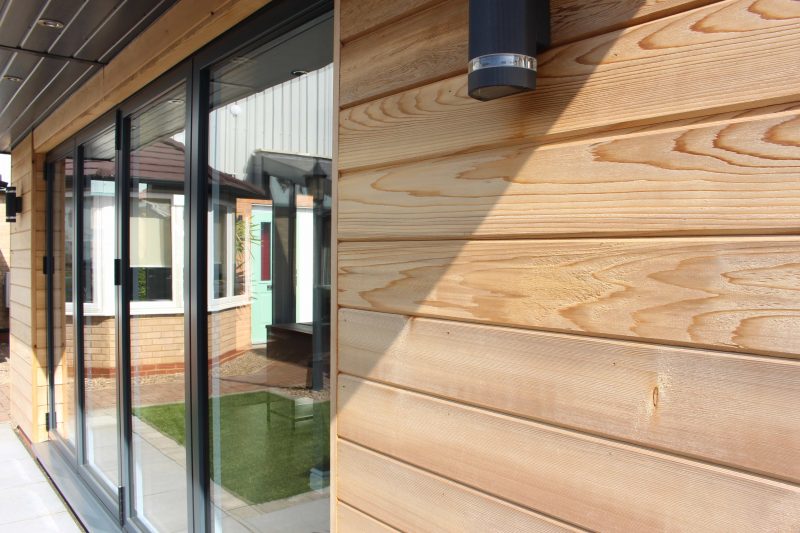 Wood effect cladded garden rooms