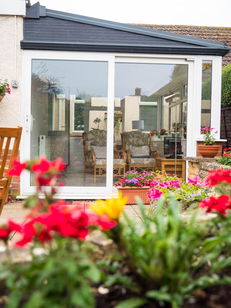 white uPVC conservatory with patio door