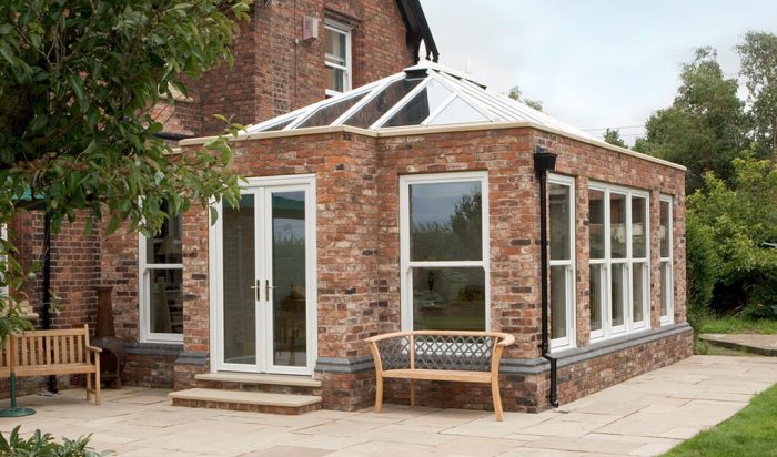 White uPVC and red brick Orangery