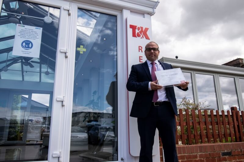 Adrian holding certificate 