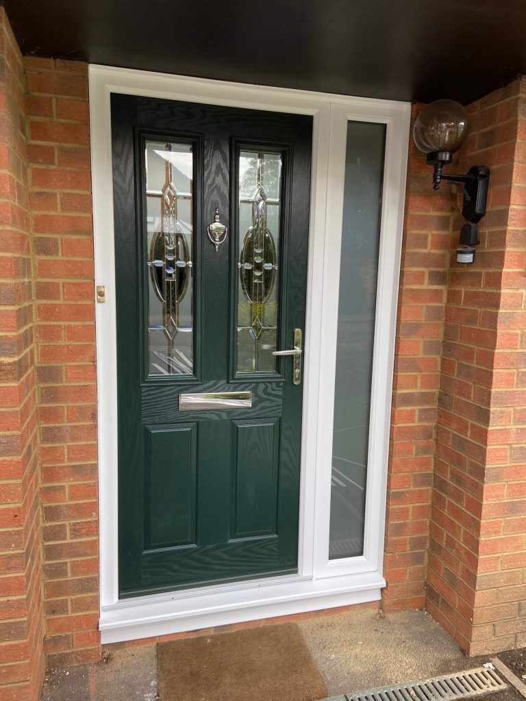 A Composite front Door with sliver door furniture